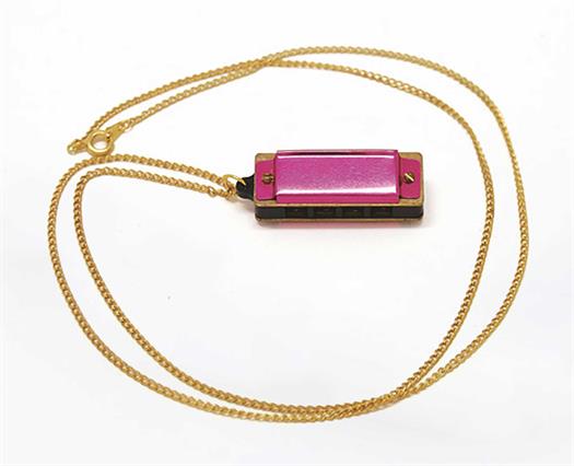 5-hole pink harmonica with necklace.