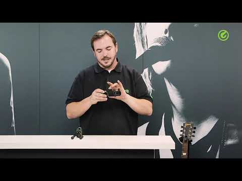 Gravity wall mounted guitar holder